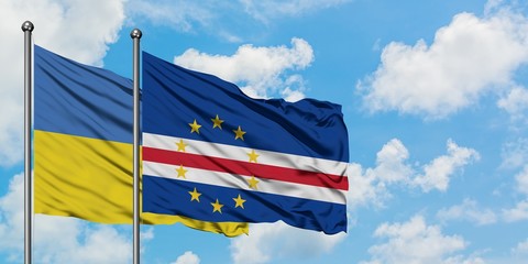 Ukraine and Cape Verde flag waving in the wind against white cloudy blue sky together. Diplomacy concept, international relations.