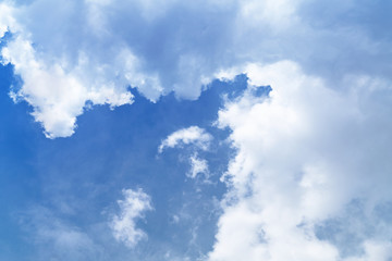 White cloud and blue sky background with copy space