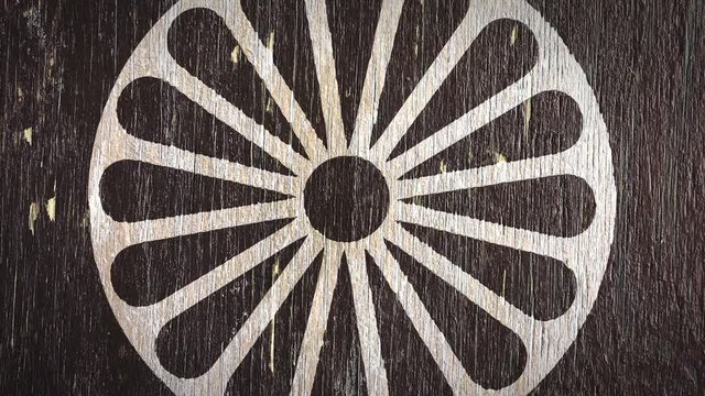 Dharmachakra - Buddhist Symbol On Wodden Texture. Ideal For Your Buddhism / Religion Related Projects. High Quality Seamless Animation. 4K, 60fps