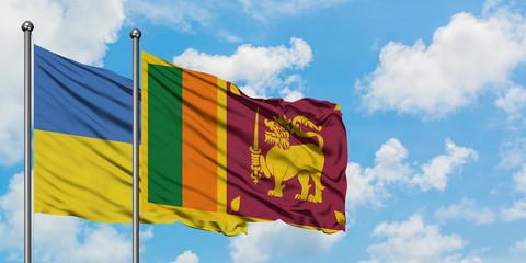 Ukraine and Sri Lanka flag waving in the wind against white cloudy blue sky together. Diplomacy concept, international relations.