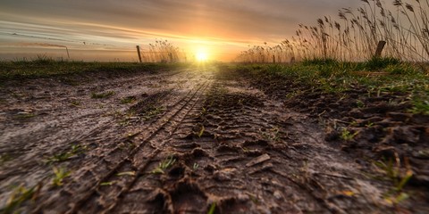 Beautiful sunset over a muddy field on the countryside