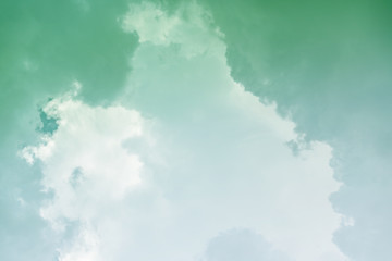 White cloud and green sky background with copy space