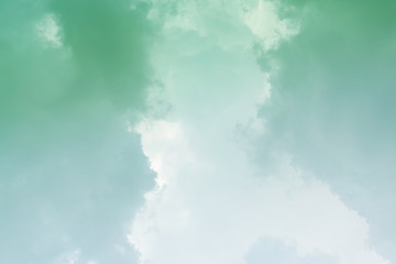 White cloud and green sky background with copy space