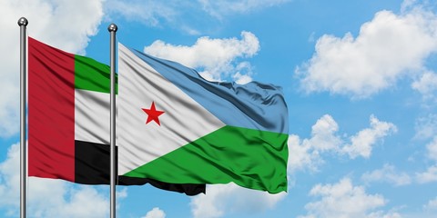 United Arab Emirates and Djibouti flag waving in the wind against white cloudy blue sky together. Diplomacy concept, international relations.