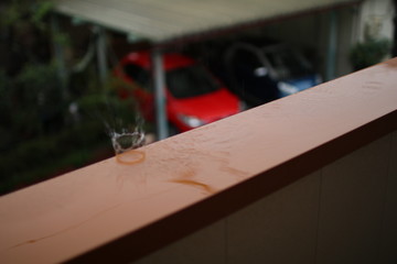 carpenter cutting plank with saw