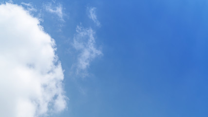 White cloud and blue sky background with copy space