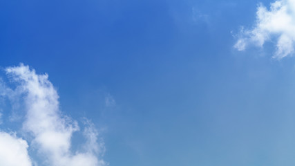 White cloud and blue sky background with copy space