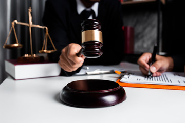 lawyer businessman working or reading law book in office workplace for consultant lawyer concept.