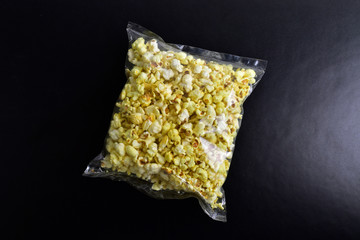 popcorn pack on black background
