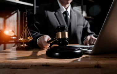 Consultation of Businessman or lawyer team meeting with client, Law and Legal services concept, Good service cooperation, Hands using tablet and laptop.