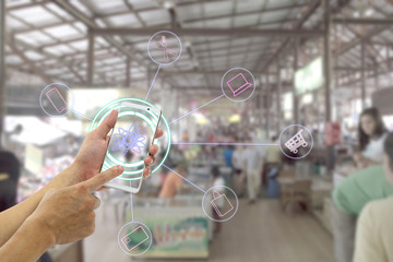 hand holding mobile smart phone with interface concept and icon for shopping in market