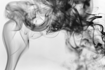 Black smoke on a light background. Abstract background stylish monochrome photo.