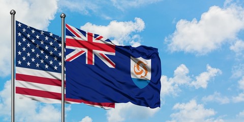 United States and Anguilla flag waving in the wind against white cloudy blue sky together. Diplomacy concept, international relations.