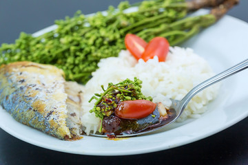 Fish grilled and Neem with sweet sauce. Tamarind Sweet & Sour Dip or Thai Dipping Sauce with boiled Neem (Thai name is Sadao nam pla wan). Neem is a Thai herb with bitter taste. 