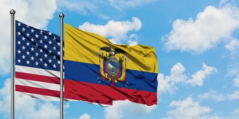 United States and Ecuador flag waving in the wind against white cloudy blue sky together. Diplomacy concept, international relations.