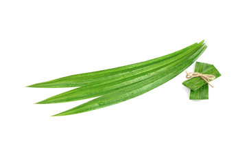 Fresh green pandan leaves with water droplets isolated on white background with clipping paths.