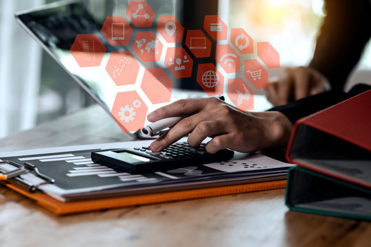 Business teamwork or business partners discussing documents and meeting at the office desk. Global Strategy Virtual Icon.Innovation Graphs Interfaces. Workplace strategy concept.