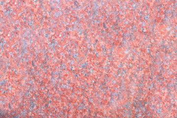 Patterns in the form of a star from marble of different colors, pink pattern on a light background, gray-white marble