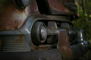 Bumper And Grill Of Abandoned And Forgotten Classic Car