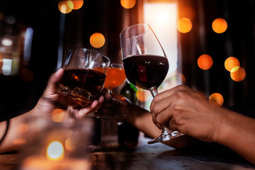 Cheers clinking of friends in party