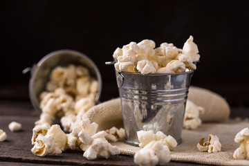 popcorn in bucket on black background