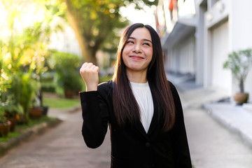 Portrait of Young beautiful Asian business woman felling happy or success working.