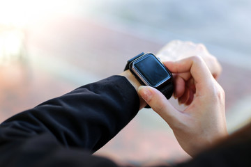  Beautiful Young businesswoman   looking at her smart watch