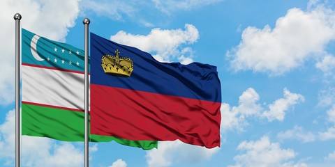 Uzbekistan and Liechtenstein flag waving in the wind against white cloudy blue sky together. Diplomacy concept, international relations.