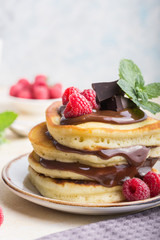 Tasty breakfast. Homemade pancakes with crushed berry, honey or maple syrup on white grey  background.