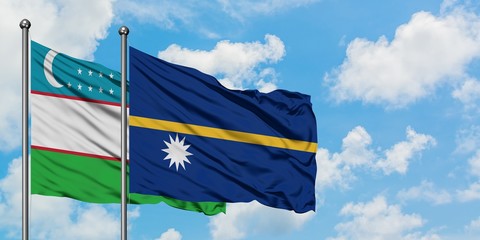 Uzbekistan and Nauru flag waving in the wind against white cloudy blue sky together. Diplomacy concept, international relations.