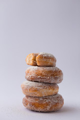 stack of Half-donut and whole donuts  pastry on white.