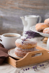 Homemade ring donuts on a rustic wooden background.  donuts with coffee candies on wooden background. Party food concept. 