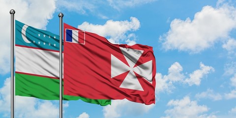 Uzbekistan and Wallis And Futuna flag waving in the wind against white cloudy blue sky together. Diplomacy concept, international relations.