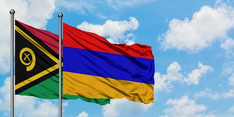Vanuatu and Armenia flag waving in the wind against white cloudy blue sky together. Diplomacy...