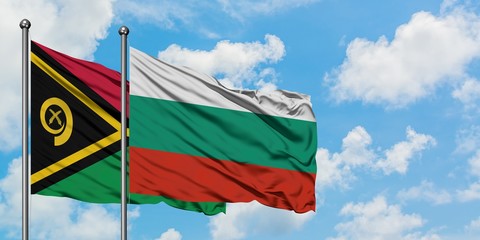 Vanuatu and Bulgaria flag waving in the wind against white cloudy blue sky together. Diplomacy concept, international relations.
