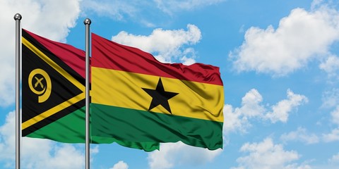 Vanuatu and Ghana flag waving in the wind against white cloudy blue sky together. Diplomacy concept, international relations.