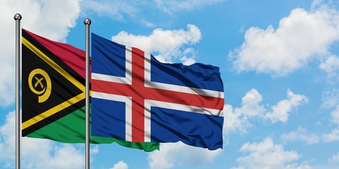 Vanuatu and Iceland flag waving in the wind against white cloudy blue sky together. Diplomacy...
