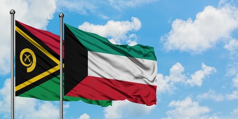 Vanuatu and Kuwait flag waving in the wind against white cloudy blue sky together. Diplomacy...