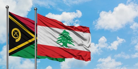 Vanuatu and Lebanon flag waving in the wind against white cloudy blue sky together. Diplomacy concept, international relations.