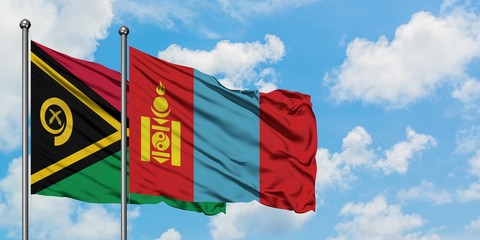 Vanuatu and Mongolia flag waving in the wind against white cloudy blue sky together. Diplomacy concept, international relations.