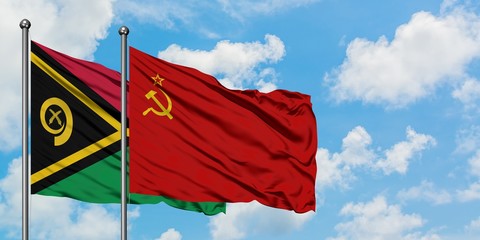 Vanuatu and Soviet Union flag waving in the wind against white cloudy blue sky together. Diplomacy concept, international relations.