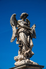 Fototapeta na wymiar Statue on Sant'Angelo bridge