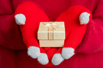 Christmas gift box. Festive composition. Red background.