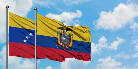Venezuela and Ecuador flag waving in the wind against white cloudy blue sky together. Diplomacy concept, international relations.