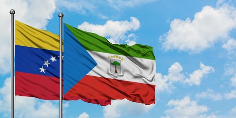 Venezuela and Equatorial Guinea flag waving in the wind against white cloudy blue sky together. Diplomacy concept, international relations.