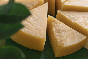 piece of cheese on wooden board