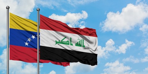 Venezuela and Iraq flag waving in the wind against white cloudy blue sky together. Diplomacy concept, international relations.