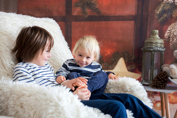 Brothers, playing at home, tickling feet laughing and smiling