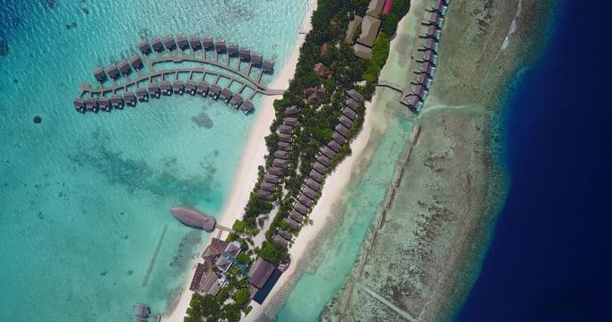 Kuramathi, tropical atoll island on Maldives, overwater bungalows and palm trees, luxury vacation concept