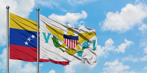 Venezuela and United States Virgin Islands flag waving in the wind against white cloudy blue sky together. Diplomacy concept, international relations.